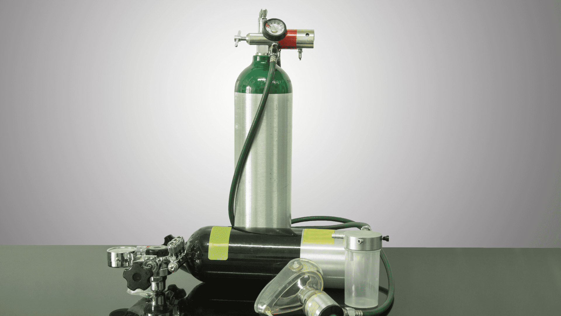 Oxygen tanks with regulator, tubing, and mask for medical use