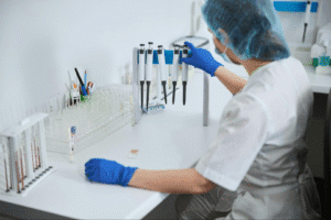Lab technician working in a clinical laboratory, illustrating the use of laboratory diagnostic tools.